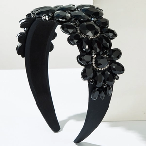 Macro shot of baroque black headband with handcrafted crystal clusters and floral design