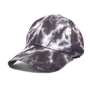 Detail of a tie-dye baseball cap in black and white tones with reinforced stitching