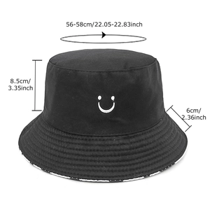 Reversible cow print smiley bucket hat with size chart for sun protection and style