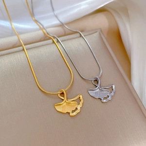 Titanium steel ginkgo leaf pendants in gold and silver colors on elegant snake chains