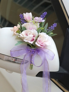 Pink roses and purple lavender wedding car decoration tied on a side mirror