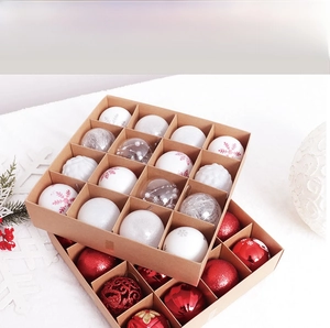 Detail view of mixed texture Christmas balls in a kraft gift box with festive ornaments
