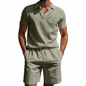 Detail of green linen polo and drawstring shorts showing texture and stitching