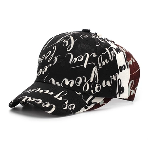 Detailed view of the script print, distressed edges and patchwork on the baseball cap