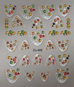 Macro shot of 3D French nail stickers Co-469 with colorful faux gemstone decorations