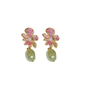 Gold-plated floral earrings with pink flower petals, sparkling rhinestones and green pearl drops