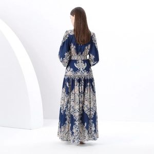 Back view of a vintage long dress with paisley print and lantern sleeves in dark blue