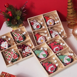 Detailed view of assorted Christmas wooden gnome ornaments set in a natural wooden gift box