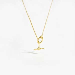 Detailed macro view of S925 sterling silver gold necklace with OT toggle clasp closure