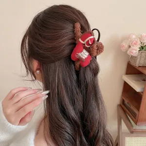 Brown plush hair claw clip with Christmas sock decor for thick hair styling