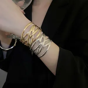 Irregular hollow layered metal open bracelet in gold and silver finish for women