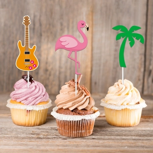 Tropical cake toppers featuring flamingo, guitar, and palm tree on summer party cupcakes
