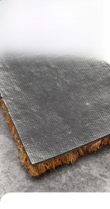Detail of natural coir fiber texture and thick non-slip PVC backing of the doormat