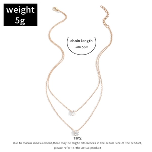 Detailed view of gold double-layer necklace with oval zircon pendants and chain dimensions