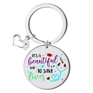 Polished stainless steel nurse keychain with colorful 'It's a beautiful day to save lives' text