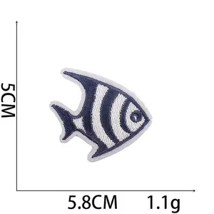 Detail of blue tropical fish embroidered patch with 5.8cm x 5cm size dimensions