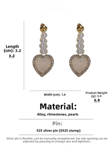 Detailed view of heart-shaped earrings with faux pearls and rhinestones 3.2cm size