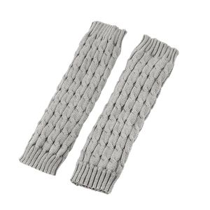 Detailed knit texture of gray cable knit leg warmers with ribbed cuffs on white backdrop