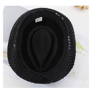 Internal view of black sequin jazz hat showing 58cm size label and polyester lining