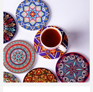 Detail showing colorful mandala coasters with intricate geometric patterns and a coffee cup