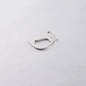 Macro detail of bird-shaped stainless steel pendant with mirror polished silver finish