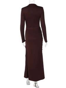 Detail of elegant dark brown maxi dress featuring long sleeves and lateral ruching design
