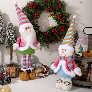 Pink and green plush Santa Claus and snowman dolls for Christmas window decoration