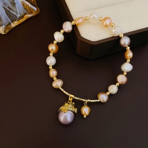 Baroque freshwater pearl bracelet with colorful pearls and golden tassel charm