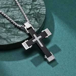 Punk two-tone cross pendant necklace in black and silver on green marble base