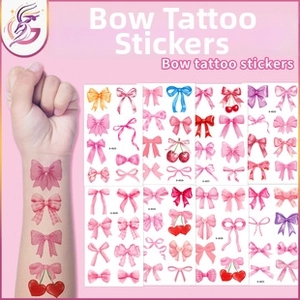 Detail of colorful bow tattoo stickers with cherry and polka dot designs for girls