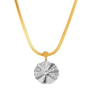 Detailed view of dual-tone snake chain necklace with silver floral textured pendant