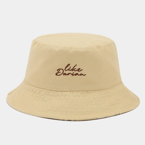 Detailed close-up of khaki bucket hat featuring Like Durian embroidery and quilted brim