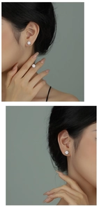 Detailed view of elegant silver six-petal flower stud earrings with sparkling cubic zirconia