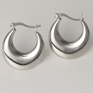 Macro view of polished silver 304 stainless steel chunky U-shaped hoop earrings
