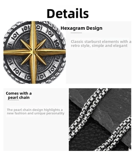 Detail of vintage round compass pendant with golden starburst and metal pearl chain