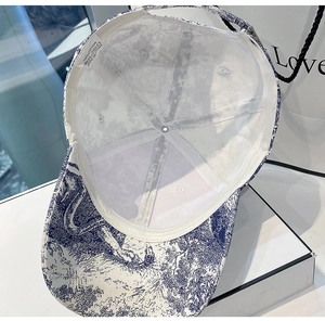 Detailed close-up of 100% cotton inner lining and stitching of printed baseball cap