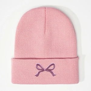 Sweet pink knitted beanie hat with purple embroidered bow design in casual Korean style