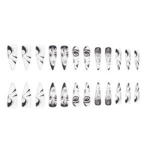 Uñas postizas stiletto largas con diseños de caras anime graffiti en blanco y negro