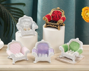 Miniature sofa jewelry display stands in various colors with ornate resin carving