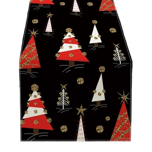 Christmas tree print apron with red and white festive patterns on a black background