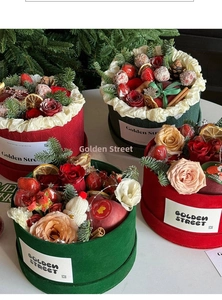 Detailed Christmas cylinder flower gift box with velvet texture and festive ornaments