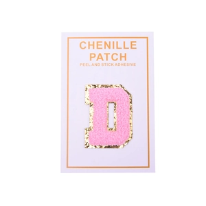 Detail of pink chenille letter D patch with gold glitter borders and self-adhesive back