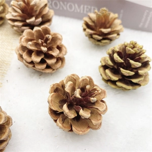 Macro view of natural brown pine cones on white faux fur for Christmas decoration