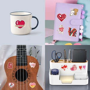 Love heart graffiti stickers shown on a mug, notebook, ukulele and storage box decor