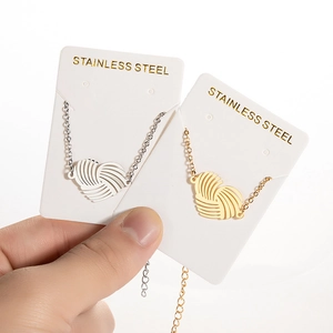 Minimalist stainless steel woven heart necklaces in gold and silver finish