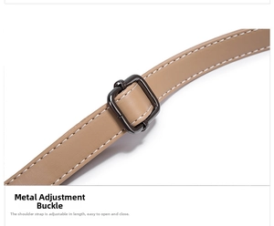 Detail of brown leather strap with white stitching and gunmetal adjustment buckle