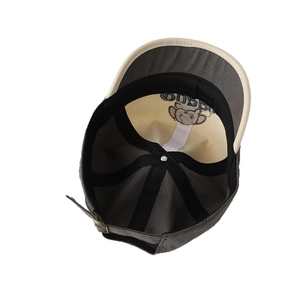 Inside view of baby baseball cap with puppy embroidery and grey contrast panels
