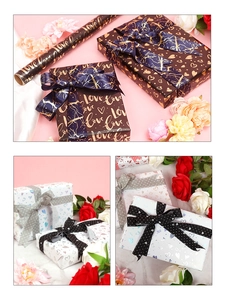 Detail of luxury gift wrapping paper with heart patterns and coordinating satin ribbons