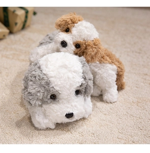 Close-up of soft grey and brown plush puppy dogs on a fluffy rug, fluffy texture details