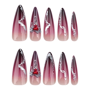 Long stiletto press-on nails with dark gradient, liquid metal art, and red heart gems